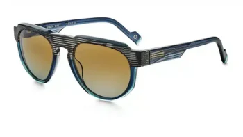 Lunettes de soleil Etnia Barcelona modèle JINBAO-54S-BKTQ en acétate noir avec détails turquoise, verres dégradés brun doré, design géométrique audacieux.